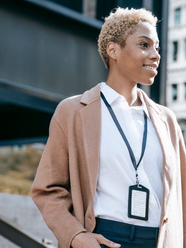A confident Black woman entrepreneur in business attire